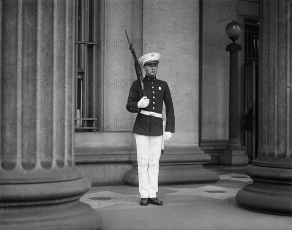 U.S. Marine Standing Guard at U.S. Treasury During Ku Klux Klan Parade, Washington DC, USA, Harris & Ewing, 1925