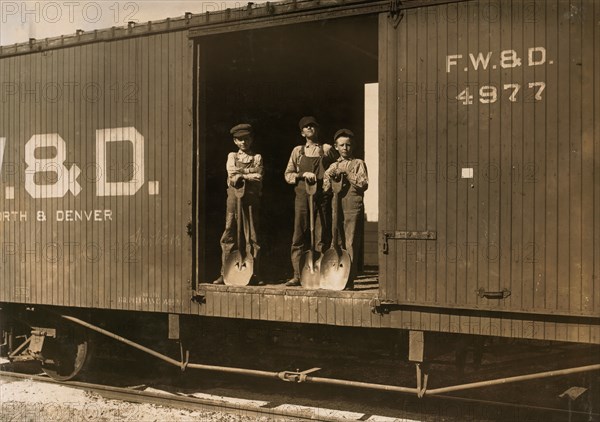 Portrait of Three Boys that Shovel Zinc Ore from Car Into Wagon, Near Big Bonanza Mine, Aurora, Missouri, USA, Lewis Hine, 1910