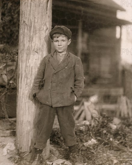 Portrait of John Holland, 10-year-old Boy, Worker at Deep River Mill rolling Bobbins, Randleman, North Carolina, USA, Lewis Hine, 1913