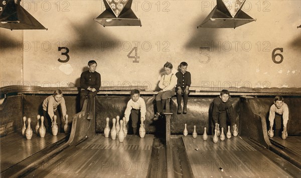 Young Boys Setting Up Bowling Pins at Arcade Bowling Alley Late at Night, Trenton, New Jersey, USA, Lewis Hine, 1909