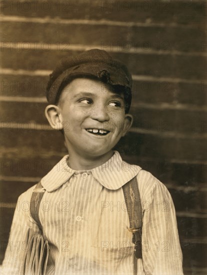 Portrait of Smiling Young Newsboy Looking Away, Saint Louis, Missouri, USA, Lewis Hine, 1910