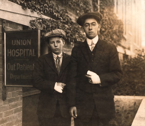 Portrait of Two 14-year-old Boys, Oscar Matoon and John Healy, with Hand Injuries Sustained while Working at Textile Mills, Fall River, Massachusetts, USA, Lewis Hine, 1916