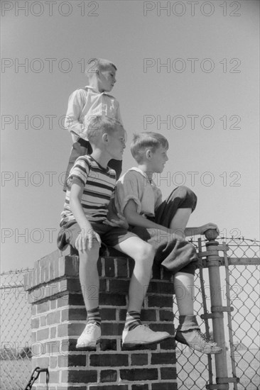 Three Spectators at Soapbox Auto Race During July 4th Celebration, Salisbury, Maryland, USA, Jack Delano for Farm Security Administration, July 1940