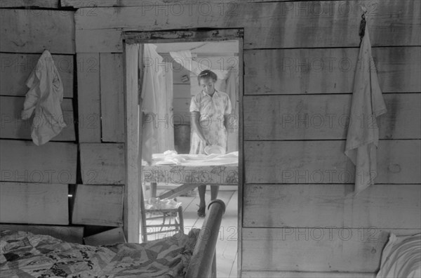 Daughter of Farm Security Administration Client Setting Table, Greensboro, Greene County, Georgia, Jack Delano for Farm Security Administration, June 1941