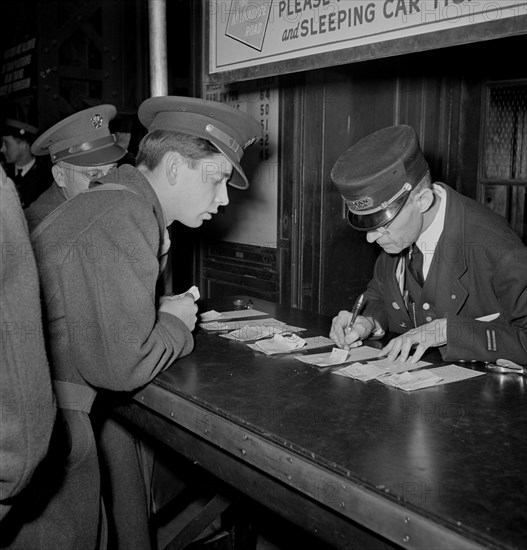 Soldier Checking Train Reservation, Union Station, Chicago, Illinois, USA, Jack Delano for Office of War Information, January 1943