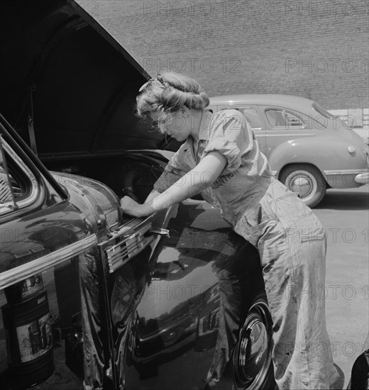 Miss Natalie O'Donald, a Garage Attendant at the Atlantic Refining Company Garages, Philadelphia, Pennsylvania, USA, Jack Delano for Office of War Information, June 1943