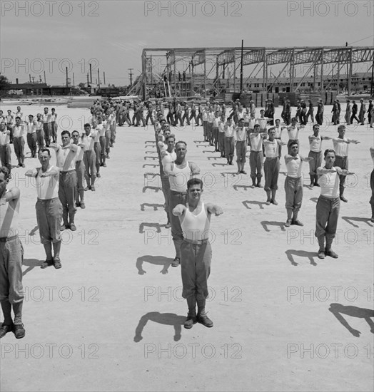 Enlisted Men Going Through Calisthenics Routine, Air Service Command, Daniel Field, Georgia, USA, Jack Delano for Office of War Information, July 1943