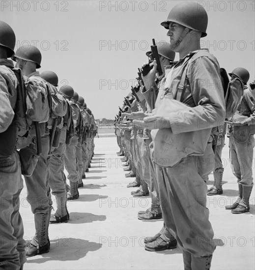 Enlisted Men Learning how to Handle a Pistol, Standing at "Inspect Pistols", Air Service Command, Daniel Field, Georgia, USA, Jack Delano for Office of War Information, July 1943