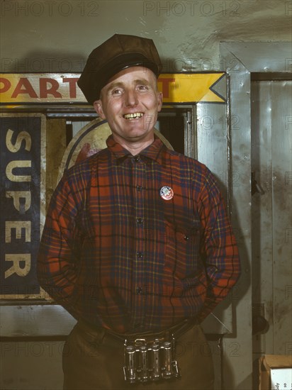 Garage Mechanic, Badge Denotes Member of Office of Defense Transportation, near Newark, New Jersey, USA, Marjorie Collins for Office of War Information, December 1943