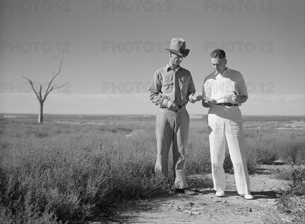 Dr. Tugwell and Farmer of Dust Bowl in Panhandle Area, President's Report, Texas, USA, Arthur Rothstein for Farm Security Administration, July 1936