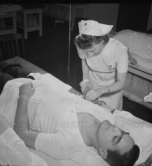 Fireman Giving Pint of Blood to Red Cross, New York City, New York, USA, Marjorie Collins for Office of War Information, January 1943