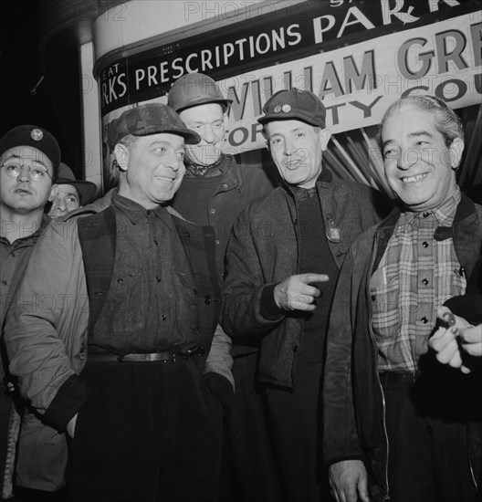 Third Shift Workers Waiting on Street Corner to be Picked up by Car Pools Around Midnight, Baltimore, Maryland, USA, Marjorie Collins for Office of War Information, April 1943