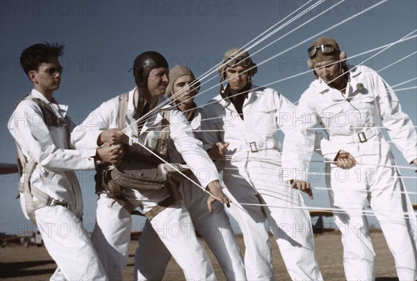 Instructor Explaining Operation of Parachute to Student Pilots, Meacham Field, Fort Worth, Texas, USA, Arthur Rothstein for Farm Security Administration (FSA), January 1942