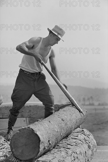 Lumber Mill Worker, Lowell, Vermont, USA, Arthur Rothstein for Farm Security Administration (FSA), September 1937