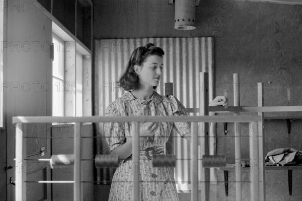 Woman Working in Weaving Shop, Farm Security Administration (FSA) Camp, Sinton, Texas, USA, Arthur Rothstein for Farm Security Administration (FSA), February 1942