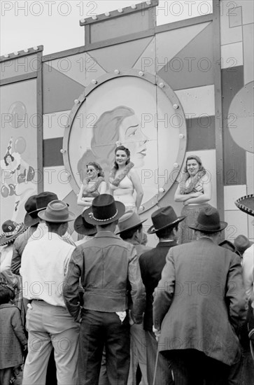 Crowd Watching Girlie Show at Carnival, Brownsville, Texas, USA, Arthur Rothstein for Farm Security Administration (FSA), February 1942