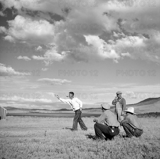 Man Pitching Horseshoes at Resettlement Administration Camp, Madras, Oregon, USA, Arthur Rothstein for Farm Security Administration (FSA), July 1936