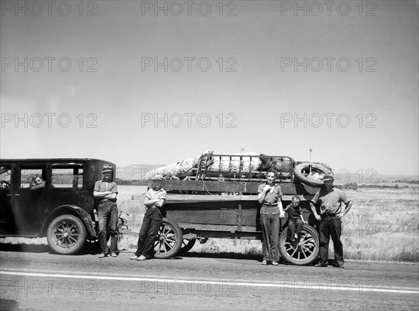 Farm Family from North Dakota Drought Area Moving West through Montana, USA, Arthur Rothstein for Farm Security Administration (FSA), July 1936