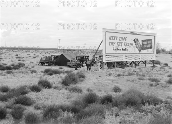 Three Families Looking for Work Camped Behind Billboard, U.S. 99, California, USA, Dorothea Lange for Farm Security Administration, November 1938