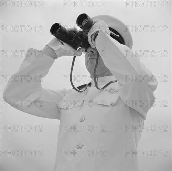 Naval Officer Looking Through Binoculars, Anacostia, Washington DC, USA, John Collier for Office of War Information, August 1941