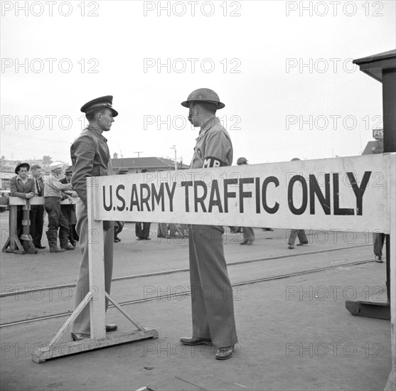 Army Sentries Standing Guard at Transport Dock one day after Japanese Attack on Pearl Harbor, San Francisco, California, USA, John Collier for Office of War Information, December 8, 1941