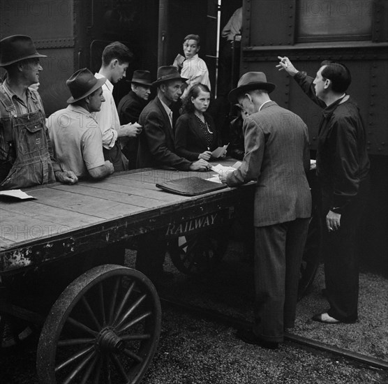 People Boarding Train for Batavia, New York, where they will help with Harvest, Richwood, West Virginia, USA, John Collier for Farm Security Administration, September 1942