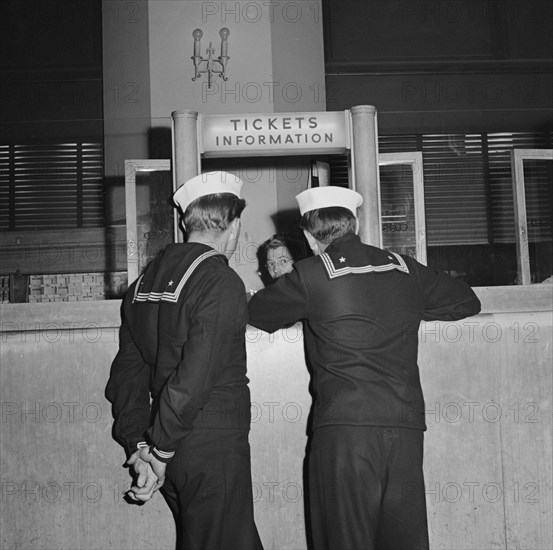 Two Sailors at Information Desk at Greyhound Bus Terminal, Chicago, Illinois, USA, Esther Bubley for Office of War Information, September 1943