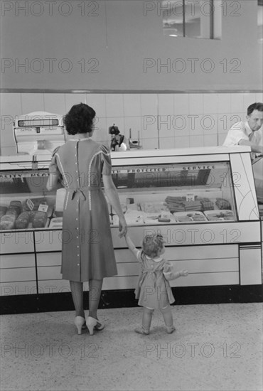 Mother with Child Shopping in Co-Op Store, Greenbelt, Maryland, USA, Marion Post Wolcott for Farm Security Administration, September 1938