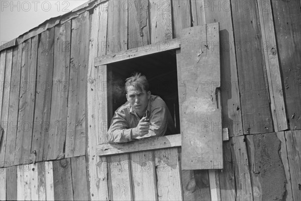 Coal Miner with Pipe Looking out Window of his Home, Bertha Hill, West Virginia, USA, Marion Post Wolcott for Farm Security Administration, September 1938