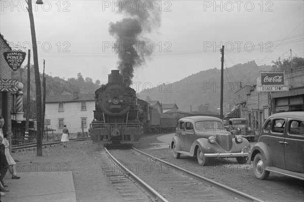 Train Pulling Through Center of Town, Osage, West Virginia, USA, Marion Post Wolcott for Farm Security Administration, September 1938