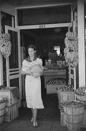 Shopper Leaving Grocery Store, Lakeland, Florida, USA, Marion Post Wolcott for Farm Security Administration, March 1939