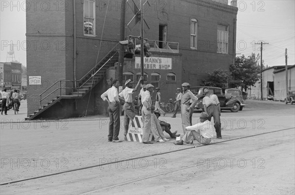 Group of Men Hanging out Near Railroad Tracks in Center of Town, Fitzgerald, Georgia, USA, Marion Post Wolcott for Farm Security Administration, March 1939