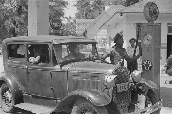 Gas Station Attendant Filling Car with Gasoline, Atlanta, Georgia, USA, Marion Post Wolcott for Farm Security Administration, June 1939