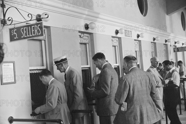 Group of Men Waging Bets on Horse Race at Betting Windows, Hialeah Park, Miami, Florida, USA, Marion Post Wolcott for Farm Security Administration, March 1939