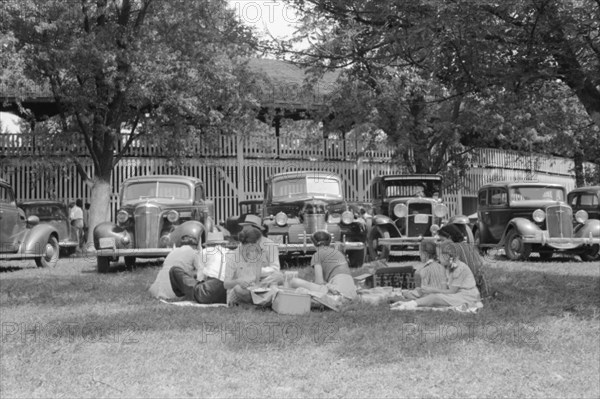 Group of People Eating Picnic Lunch, Shelby County Horse Show and Fair, Shelbyville, Kentucky, USA, Marion Post Wolcott for Farm Security Administration, August 1940