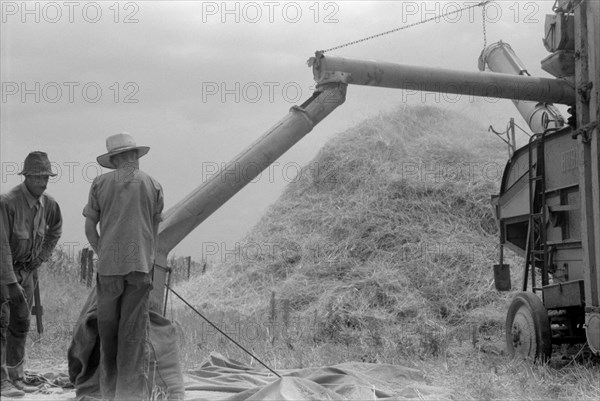 Two Men Threshing Wheat on Farm, Oldham County, Kentucky, USA, Marion Post Wolcott for Farm Security Administration, July 1940