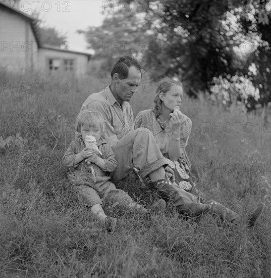 Farm Family Eating Ice Cream along Cane River on Fourth of July, near Natchitoches, Louisiana, USA, Marion Post Wolcott for Farm Security Administration, July 1940