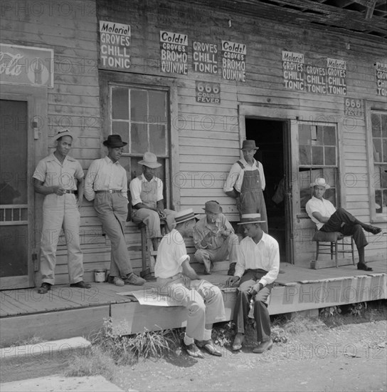 Group of Men Hanging out on Porch of Country Store, Port Gibson, Mississippi, USA, Marion Post Wolcott for Farm Security Administration, August 1940