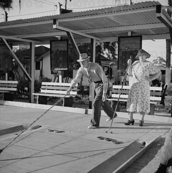 Elderly Couple Playing Shuffleboard, Sarasota Trailer Park, Sarasota, Florida, USA, Marion Post Wolcott for Farm Security Administration, January 1941