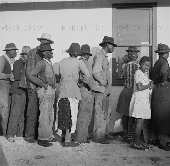Migratory Workers waiting to Receive Supplies of Surplus Commodities, Belle Glade, Florida, USA, Marion Post Wolcott for Farm Security Administration, January 1941