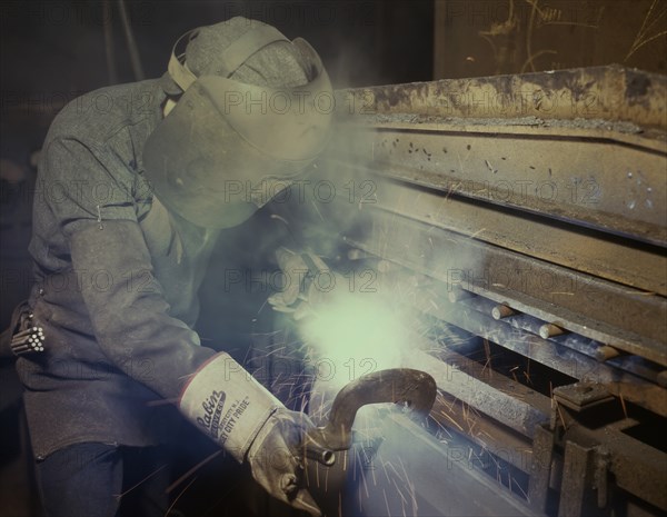 Welder Making Boilers for Ship, Chattanooga, Tennessee, USA, Alfred T. Palmer for Office of War Information, June 1942