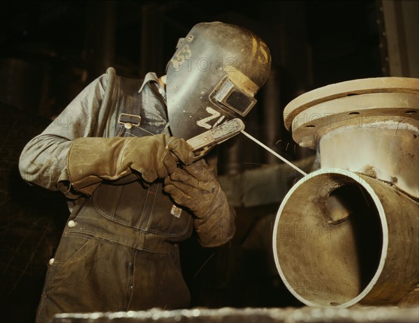 Welder Making Boilers for Ship, Chattanooga, Tennessee, USA, Alfred T. Palmer for Office of War Information, June 1942