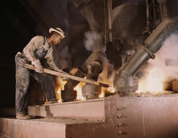 Man Working at Electric Phosphate Smelting Furnace in TVA Chemical Plant, near Muscle Shoals, Alabama, USA, Alfred T. Palmer for Office of War Information, November 1942