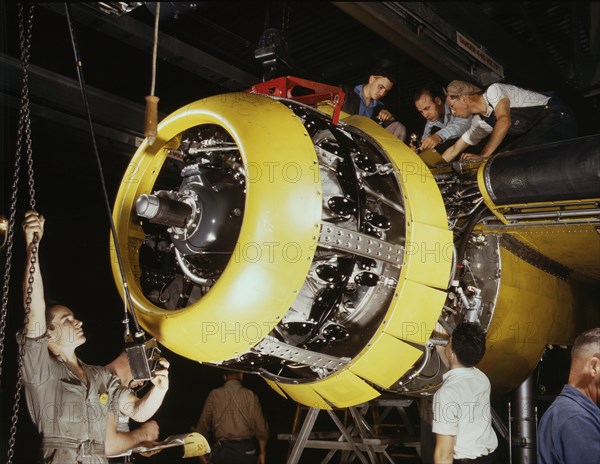 Workers Mounting Motor on Fairfax B-25 Bomber, North American Aviation Plant, Inglewood, California, USA, Alfred T. Palmer for Office of War Information, 1942
