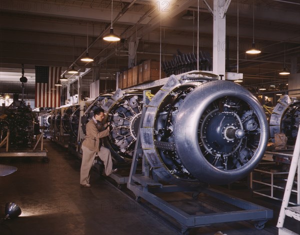 Worker Adding Cowling and Control Rods to Motors of B-25 Bombers on Assembly Line, North American Aviation Plant, Inglewood, California, USA, Alfred T. Palmer for Office of War Information, October 1942