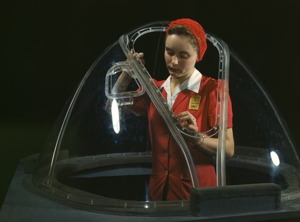 Female Worker Putting Finishing Touches on Bombardier Nose Section of B-17F Navy Bomber, Douglas Aircraft Company, Long Beach, California, USA, Alfred T. Palmer for Office of War Information, October 1942