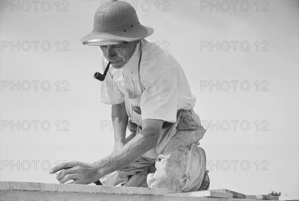 Carpenter Working in Model Community Planned by Suburban Division of U.S. Resettlement Administration, Greenbelt, Maryland, USA, Carl Mydans for U.S. Resettlement Administration, August 1936