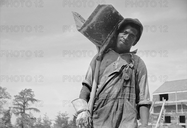 Construction Worker in Model Community Planned by Suburban Division of U.S. Resettlement Administration, Greenbelt, Maryland, USA, Carl Mydans for U.S. Resettlement Administration, August 1936