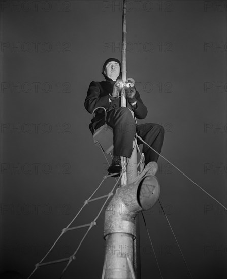 Bill Welch, Junior Commander, Coast Guard Auxiliary, on Patrol Duty, Marblehead, Massachusetts, USA, Alfred T. Palmer for Office of War Information, February 1943