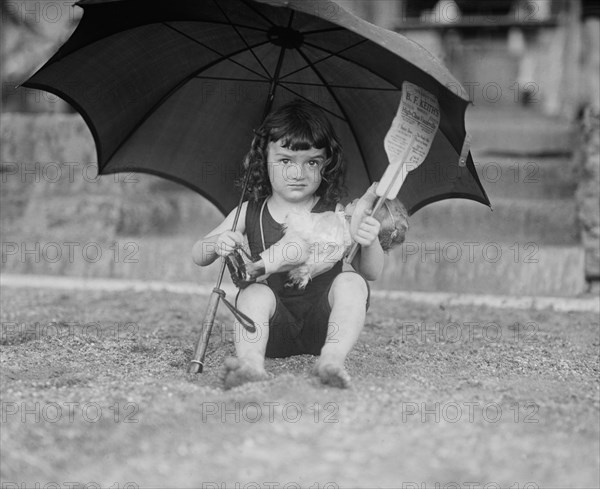 Young Girl in Bathing Suit Holding Doll and Sun Umbrella, National Photo Company, June 1923